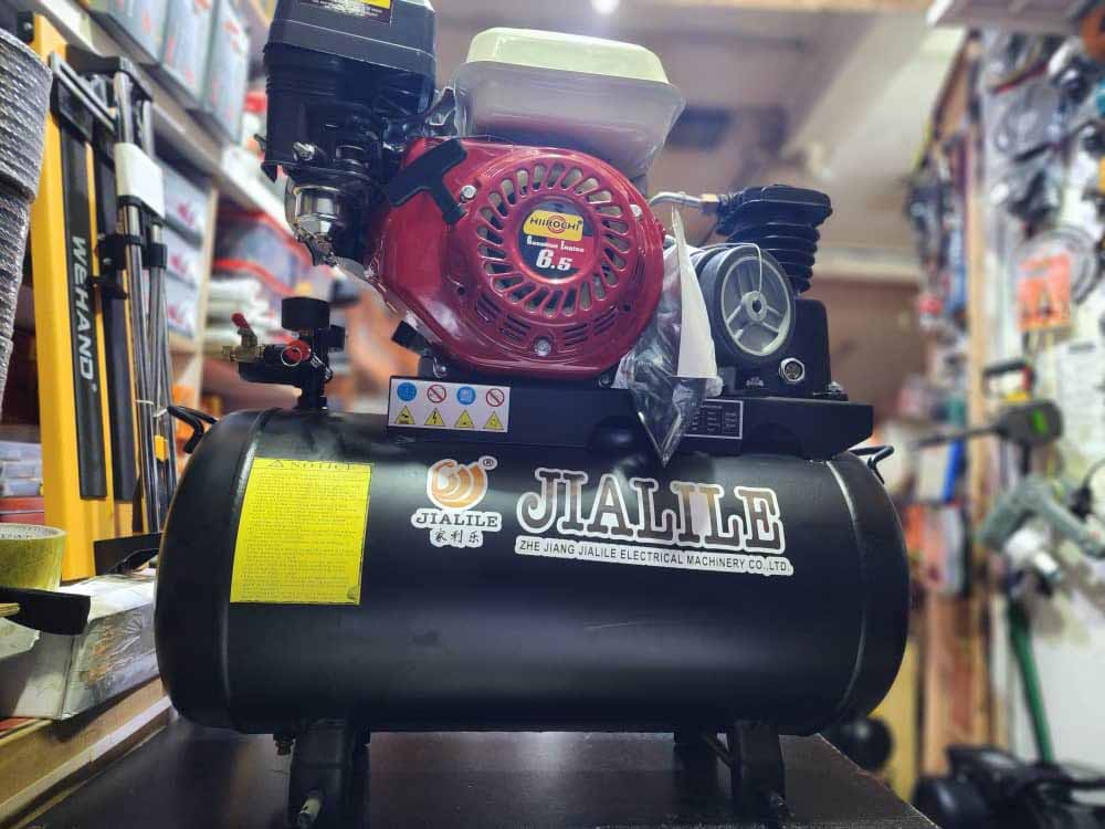 Air Compressor Uganda. Air Compressor Portable 50 Litres 6.5HP Petrol Engine With Heavy Duty Piston Head for Sale in Kampala Uganda. Machine World Uganda, Leading Air Compressors Company in Uganda: Supplier, Importer, Distributor, Assembler and Installer of Domestic and Industrial Air Compression Equipment in Kampala-Uganda, East Africa: Kigali-Rwanda, Nairobi-Mombasa-Kenya, Juba-South Sudan, DRC-Congo, Tanzania. Machinery Uganda